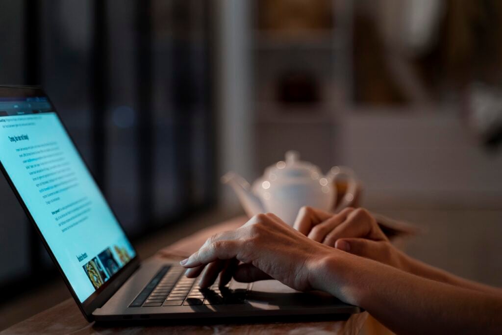 How Much Does It Cost to Make a Landing Page? 6 close-up-person-working-home-night