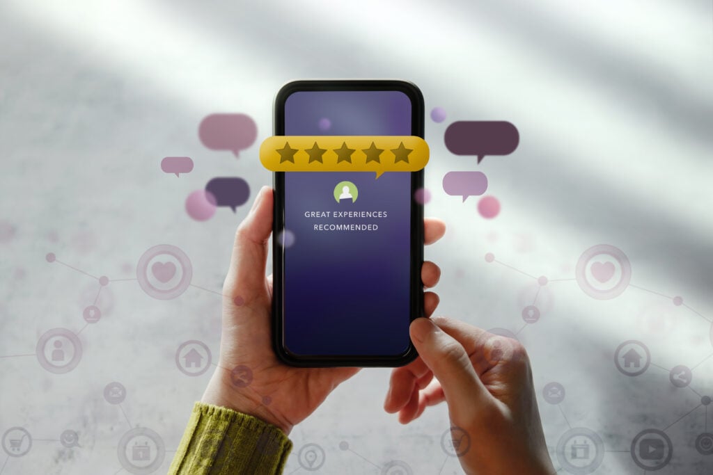 Best Website Design Company for Cleaning Services 5 smiling-happy-businesswoman-headphones-sits-desk-looks-laptop-screen-making-notes-participating-self-improvement-webinar