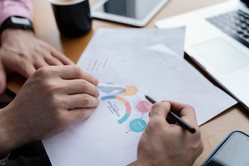 Best Website Design Company for Cleaning Services 2 high-angle-male-coworkers-analyzing-graph-work
