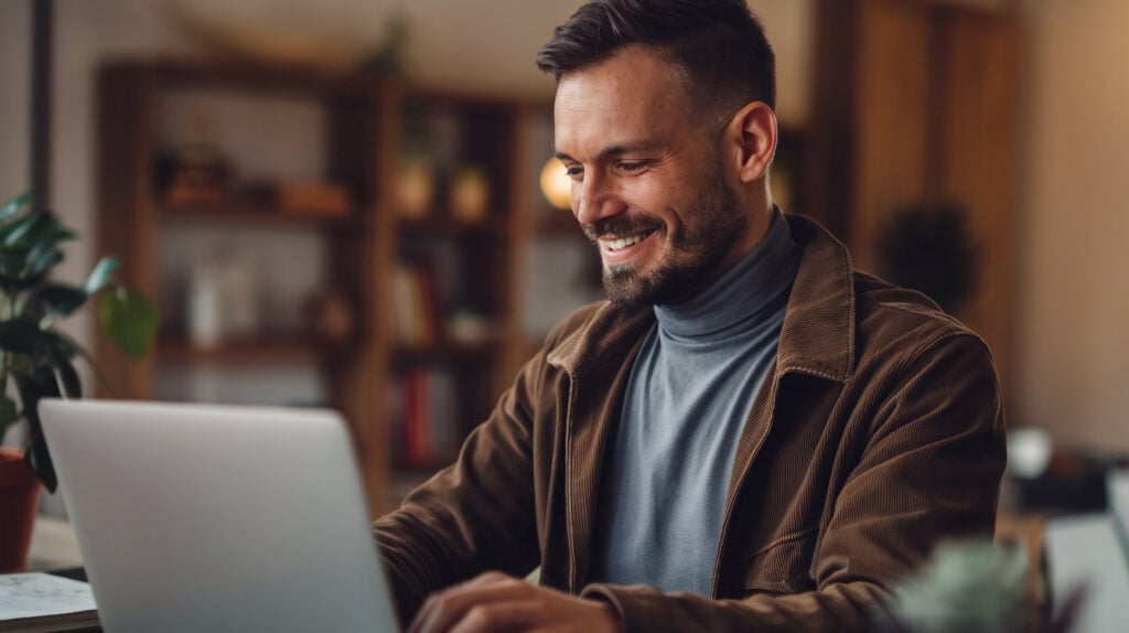 WordPress vs Next.js: Which Is Better for Building Your Website 3 man-sits-computer-looks-screen