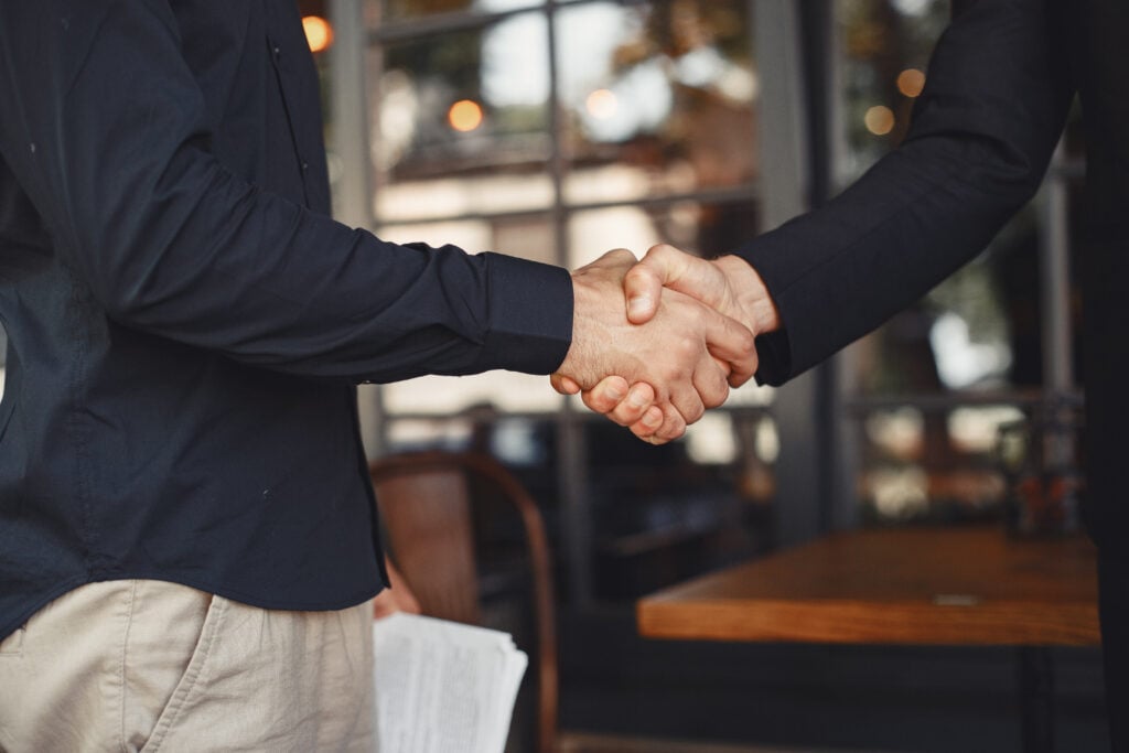 Best Website Design Company for Cleaning Services 1 men-shake-hands-enclosure-business-agreement-understanding-business-partners