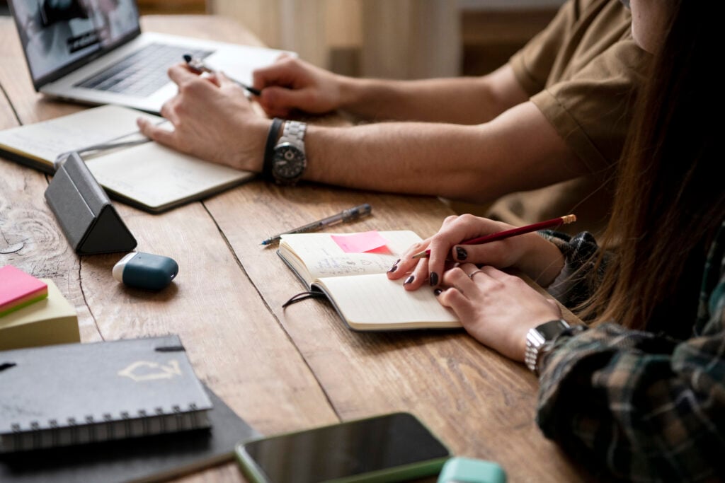 WordPress vs Sitefinity: Which CMS Is Better for You 6 two-friends-searching-laptop-information-study-session