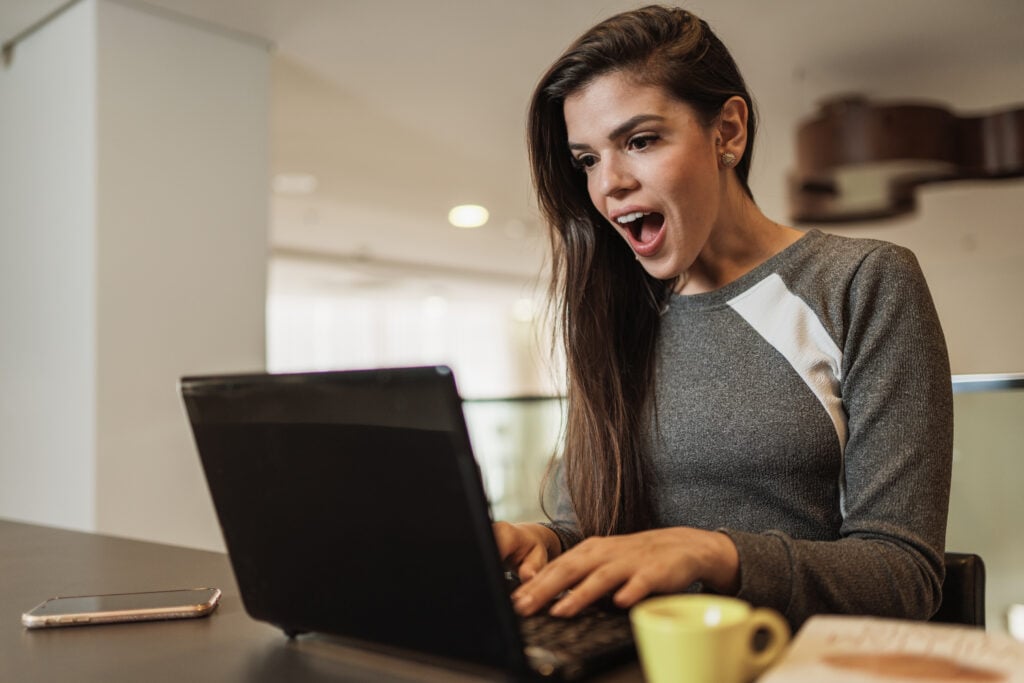 WordPress vs Sitefinity: Which CMS Is Better for You 7 young-beautiful-brazilian-woman-working-with-laptop-while-sitting-office-desk