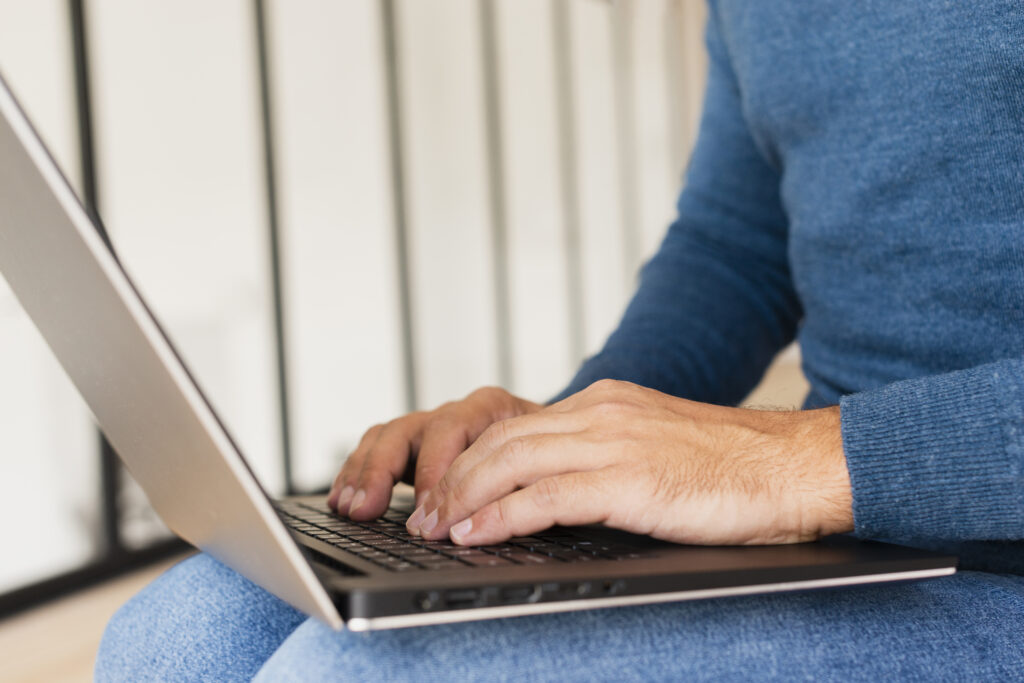 Website Maintenance Cost: How Much Should You Budget? 9 close-up-man-home-working-laptop