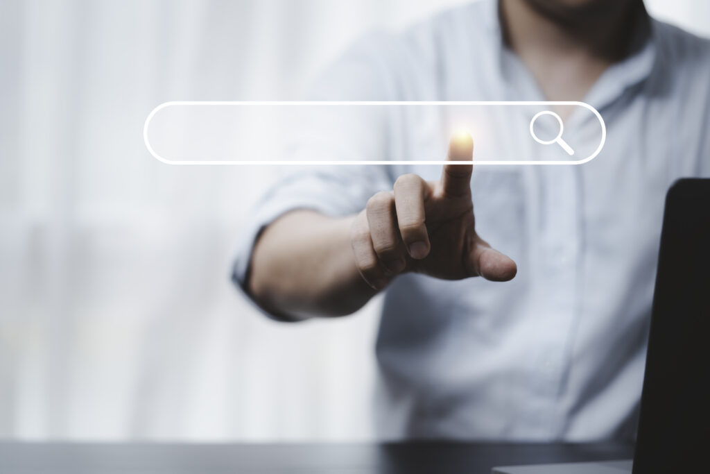 Hand touching with search icon for Search Engine Optimisation or