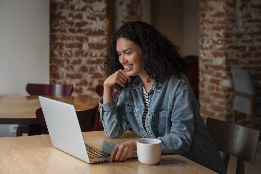 medium-shot-woman-with-laptop-coffee-shop
