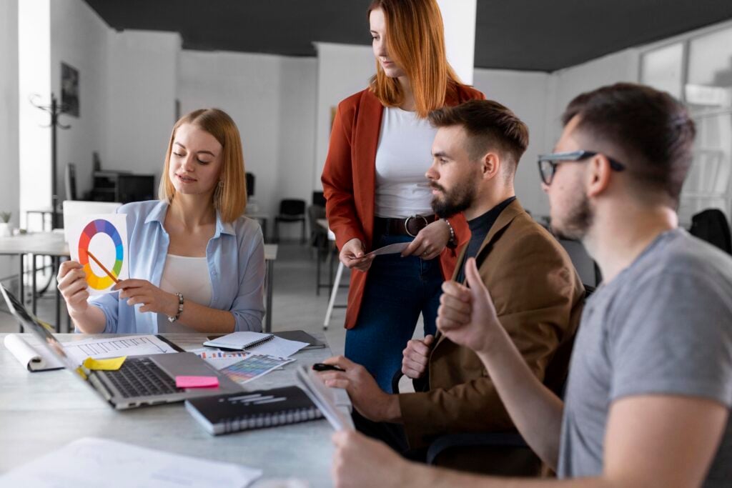 Hiring a Website Redesign Agency: A Simple Guide 2 people-brainstorming-work-meeting