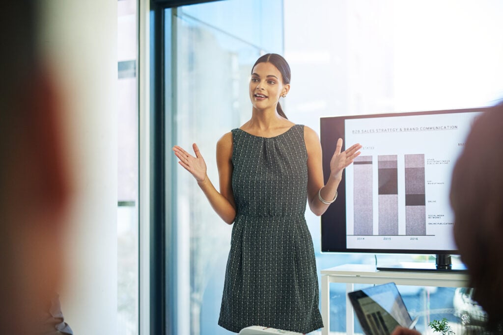 What Is the Difference Between UI and UX Design? (Full Guide) 4 woman-boardroom-graphs-screen-presentation-report-feedback-as-finance-analyst-business-clients-people-meeting-financial-solution-company-growth-statistics-results