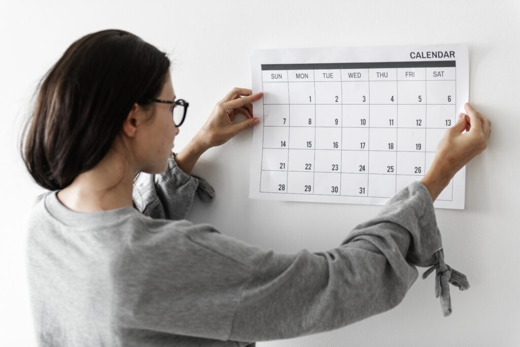 Website Maintenance Cost: How Much Should You Budget? 1 Woman checking the calendar